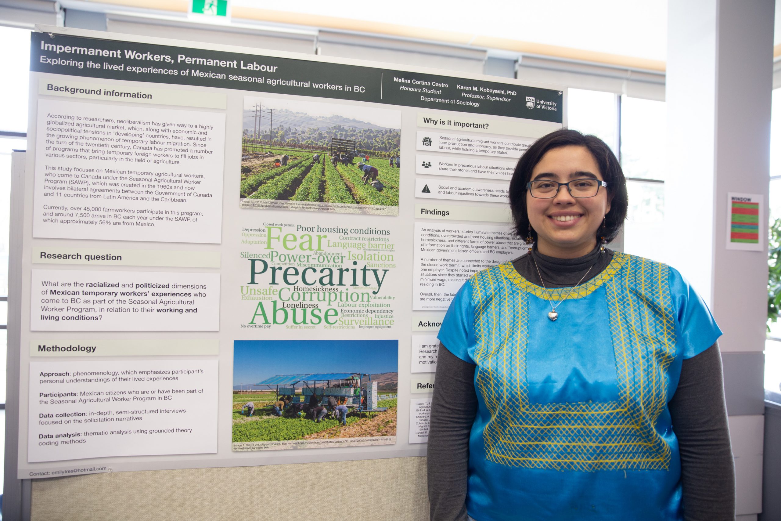 Student (Melina) standing next to their research poster at the 2019 JCURA research Fair