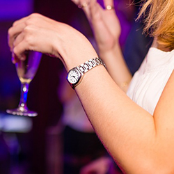 A photo of a woman holding a champagne glass