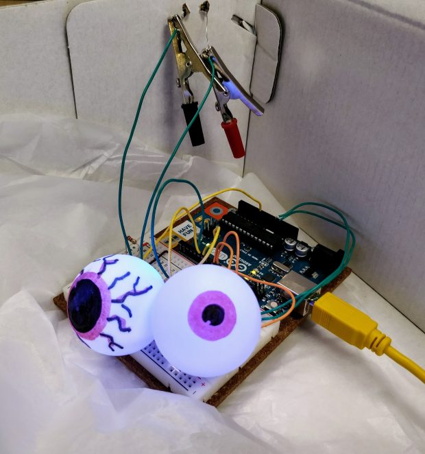Photo of Arduino project from workshop with spooky eyes