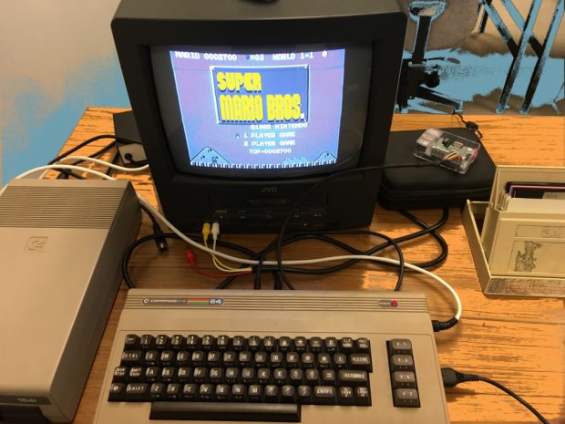 Photo of a vintage computer with Super Mario Bros on the screen