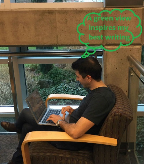 photo of student writing near a window
