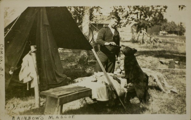 Post Card of a crew member from the Rainbow with their mascot, in Comox, B.C. photo source:Maritime Museum of British Columbia