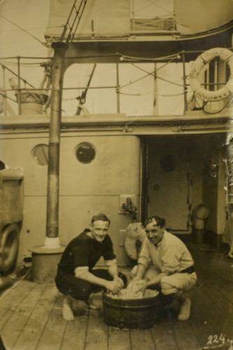 Wedgewood and Reed doing laundry on the deck. (1913)