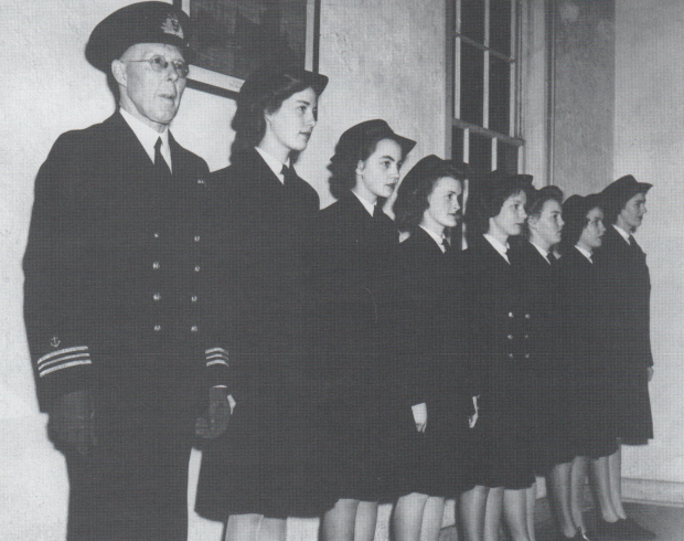 LCdr. Tribe and girls employed to work in the Ship's Office. Gladys Baxter, is identifiable by the gold buttons on her jacket, circa 1944