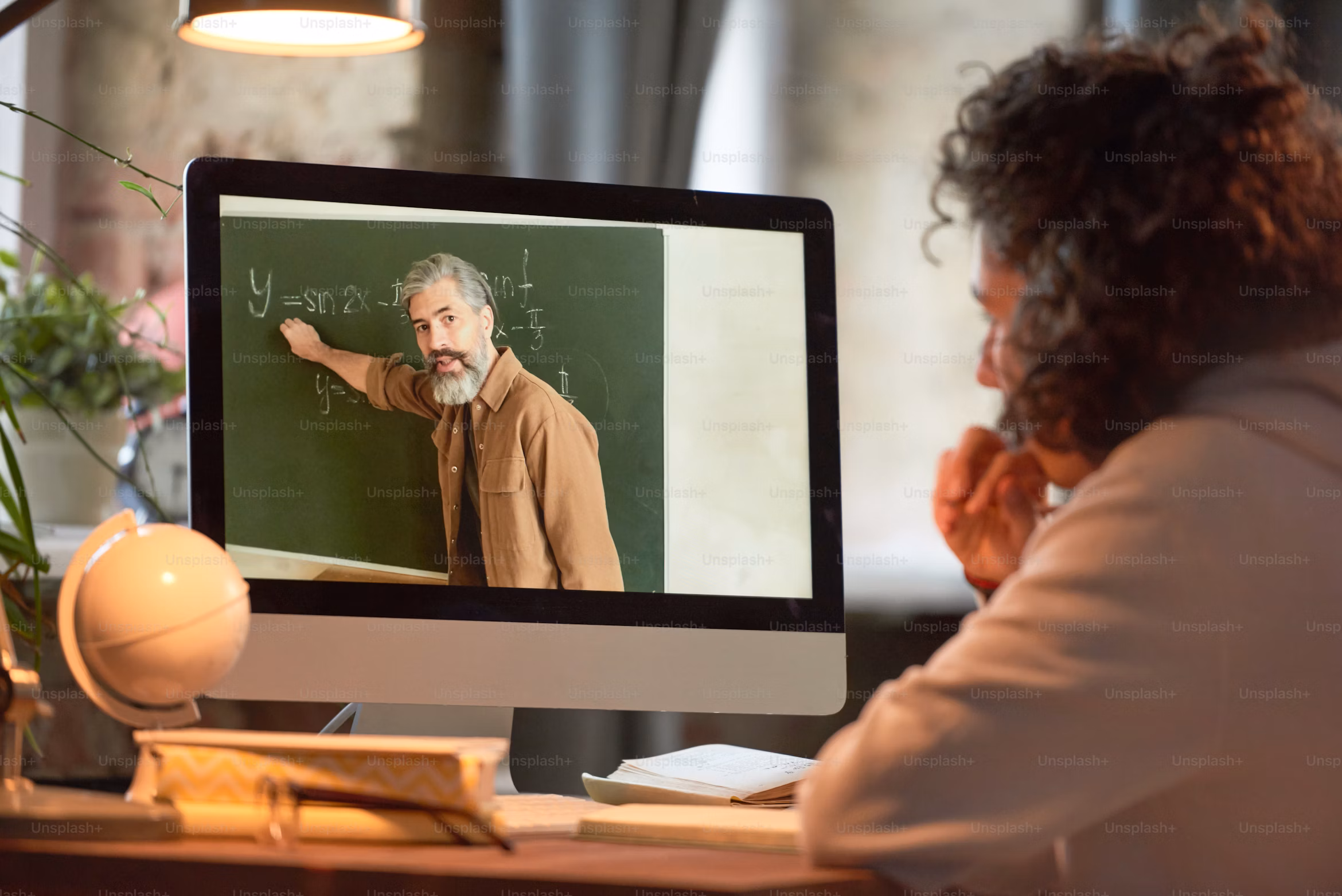 woman looking at a computer screen showing lecture