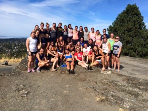 The team post 1600m test with a run up Mount Tolmie.