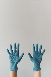 hands wearing rubber gloves