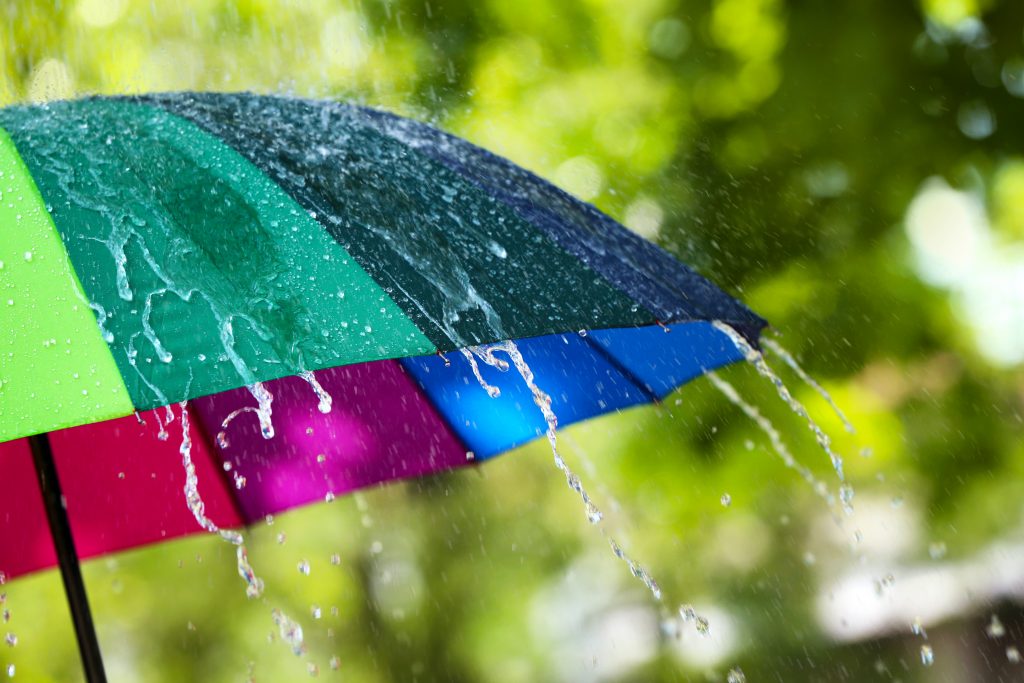 Colorful umbrella outdoors on rainy day