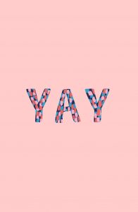 The colorful word 'yay' on a light pink background