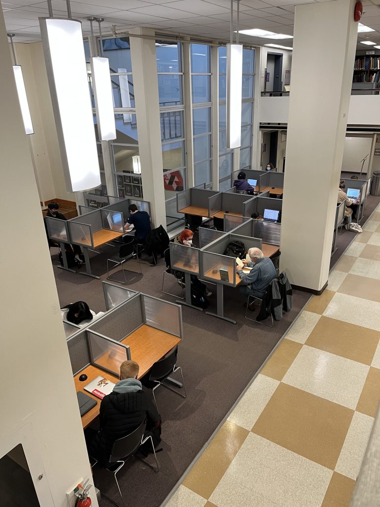 Students studying at desks in the library
