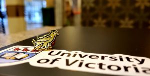 UVic alumni pin and sticker