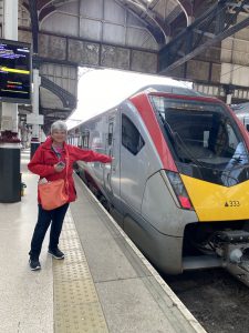 woman pointing at train