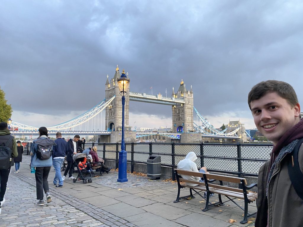 Man in front of London bridge