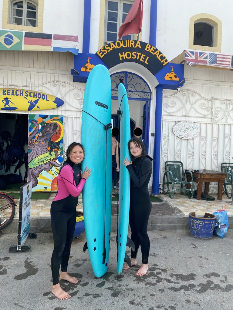 2 women with surfboards