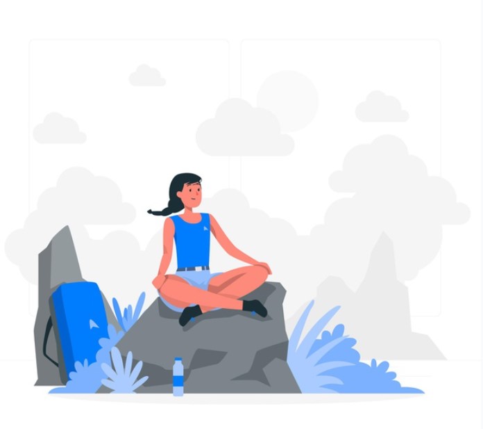woman hiking/doing yoga on top of mountain