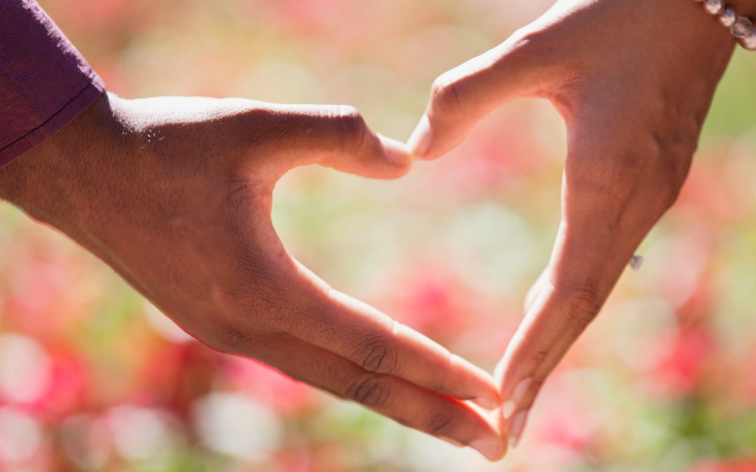 hands uniting to form a heart