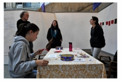 Artist Teresa Vander Meer-Chassé talking with UVIC instructors and students around table.