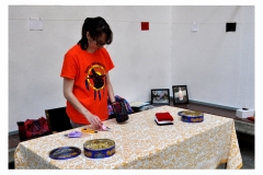 Artist Teresa Vander Meer-Chassé arranging supplies at the beading table.