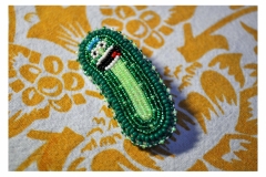 Close up of beaded pickle Rick by artist Teresa Vander Meer-Chassé.