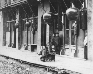 Chinese children on the sidewalk on Fisgard Street.